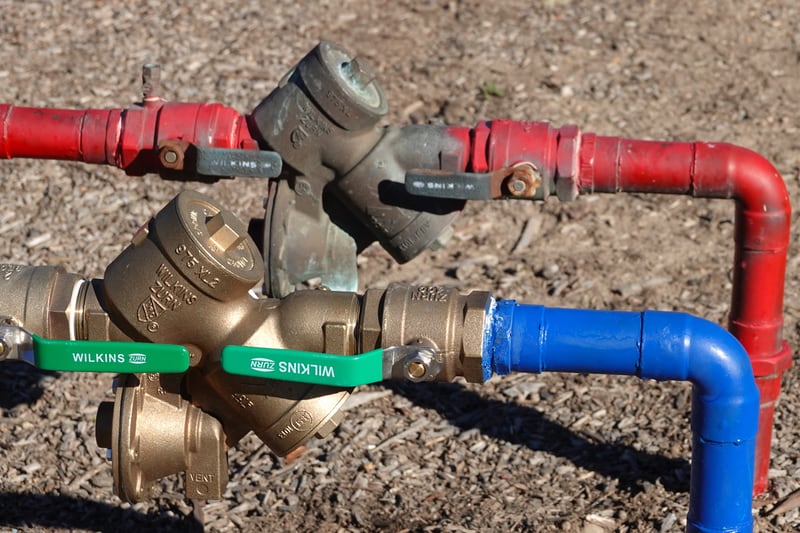 Backflow prevention valve on pipes.
