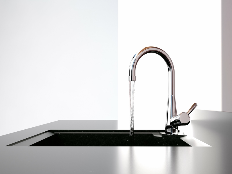 Modern kitchen faucet with running water