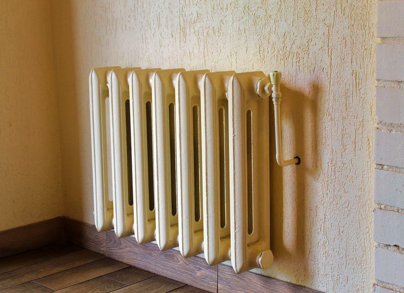 Vintage radiator against a wall