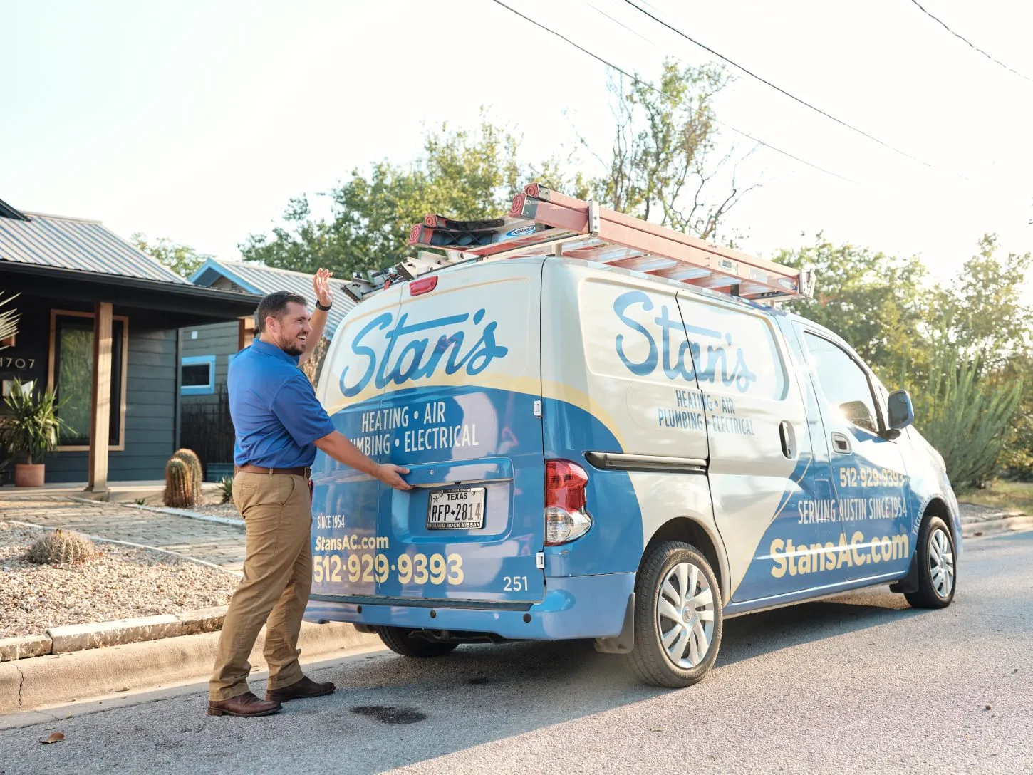 Technician retrieving equipment from Stan's van, Austin.