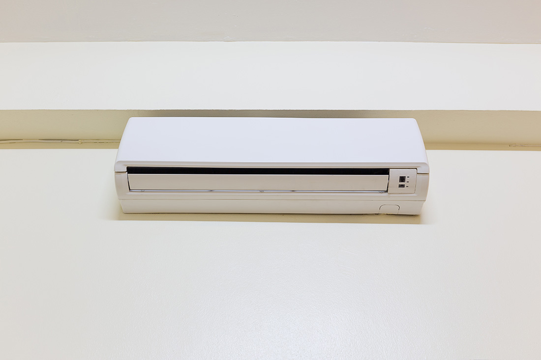 Mini-split AC unit mounted on a wall.