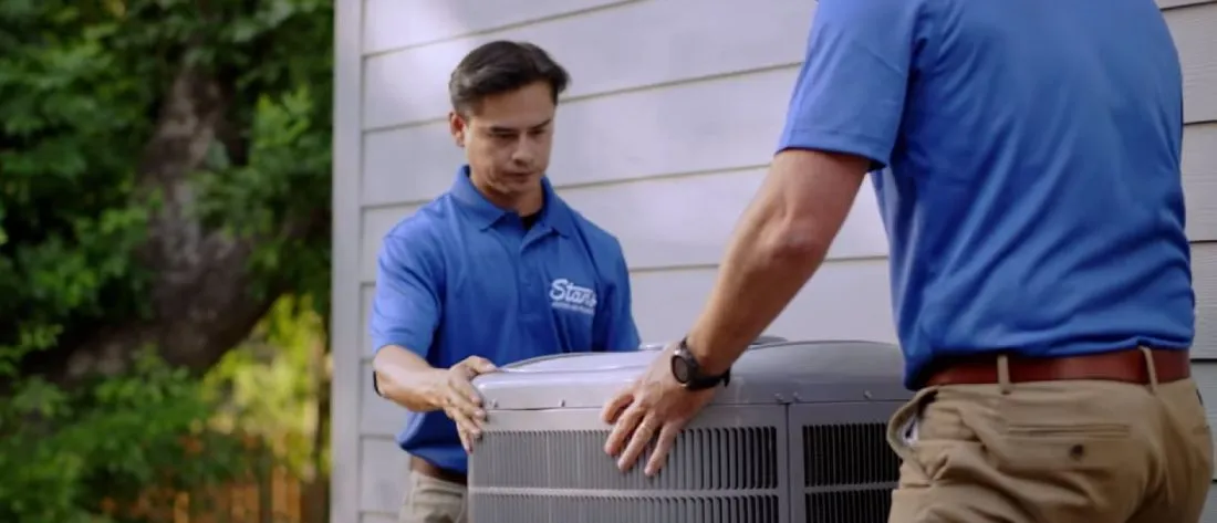 stan's hvac technicians installing an air conditioner