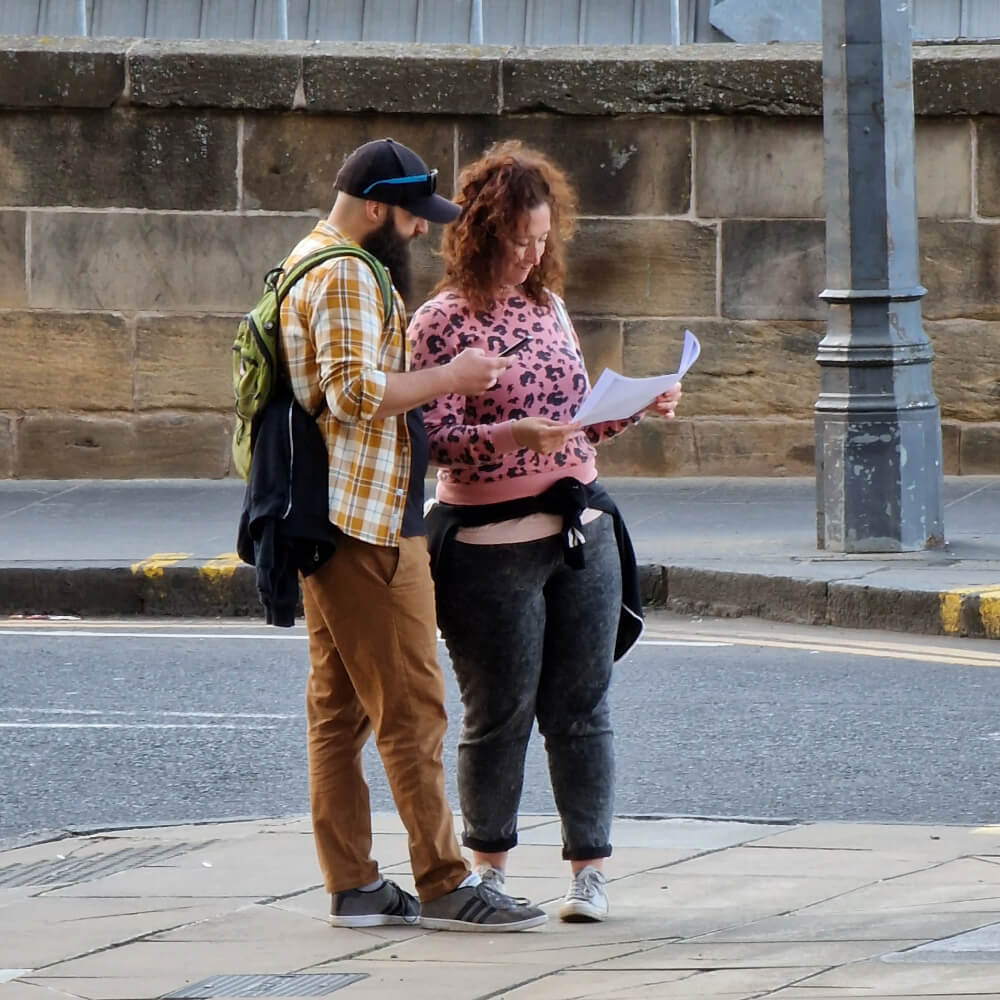 Two people looking at a image part way through the hunt