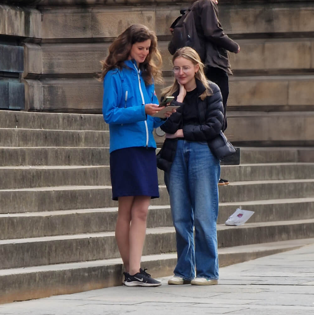 Two people starting the hunt outside the National Museum of Scotland