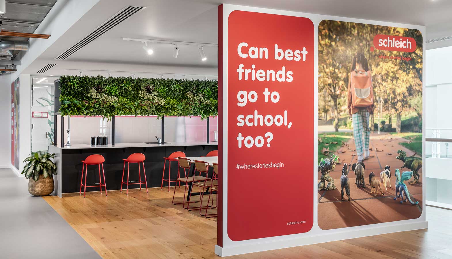 Schleich Head Office full drop graphics on wall, kitchen area dressed with artificial plants and flowers to create that double take effect as you walk in.