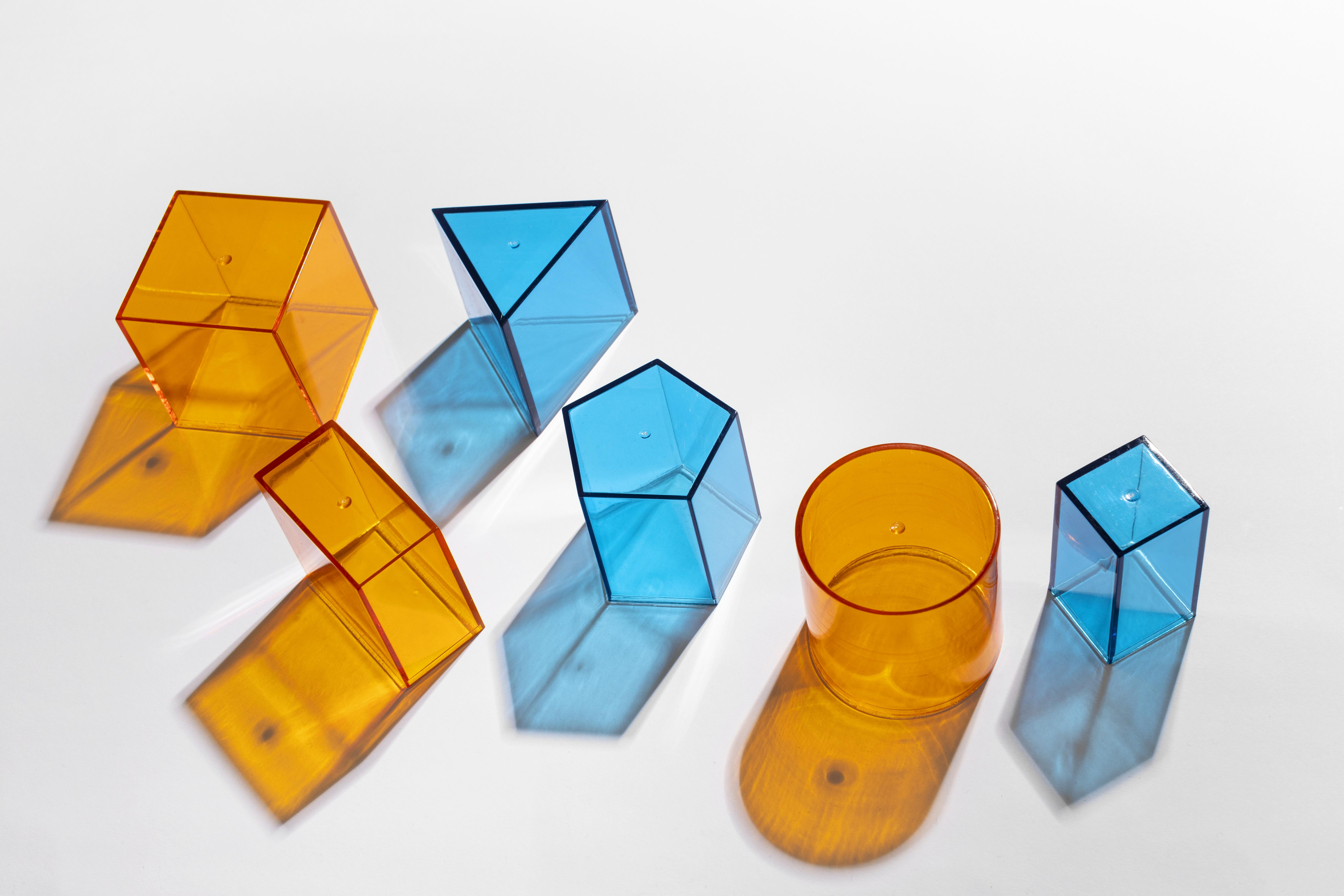 Translucent colorful geometric shapes representing the diverse skills and anti-fragility of Latin American talent in a changing labor market.