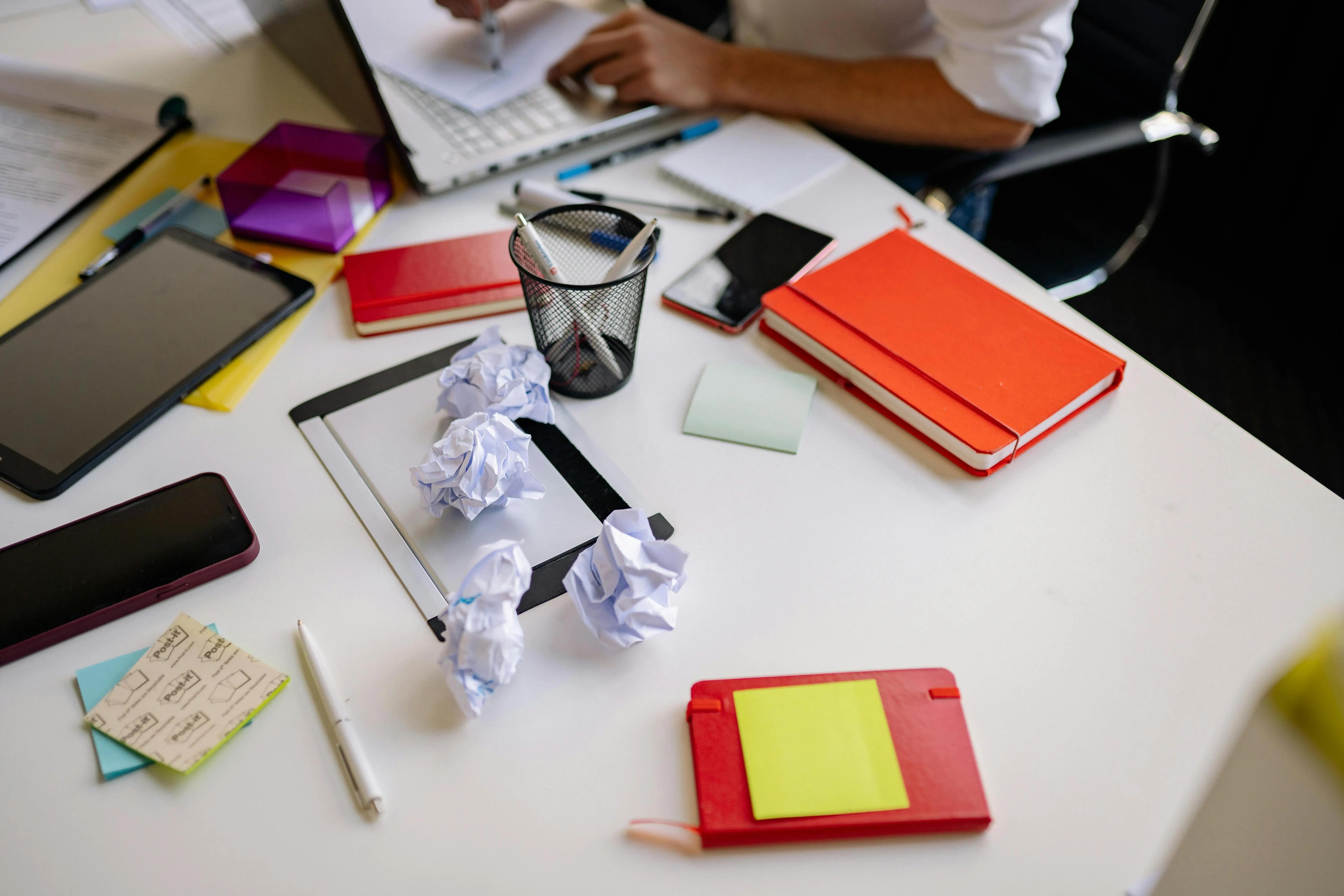 A messy desk in a Markham office workspace, emphasizing the need for daily clutter-free desk policies as part of workplace cleaning habits.