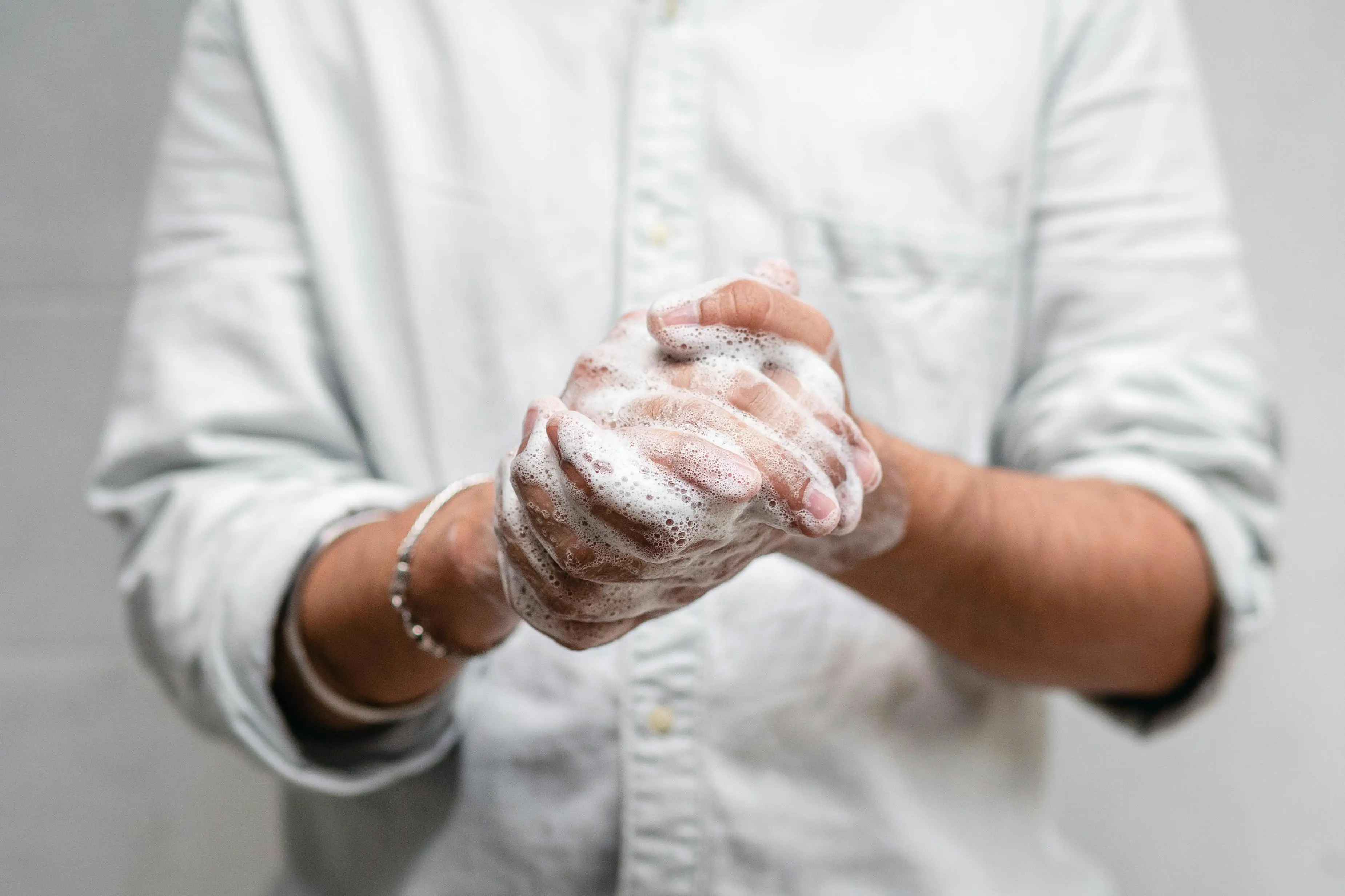 Employee practicing hand hygiene in a Markham office, supporting workplace cleaning habits that improve health and reduce germs.