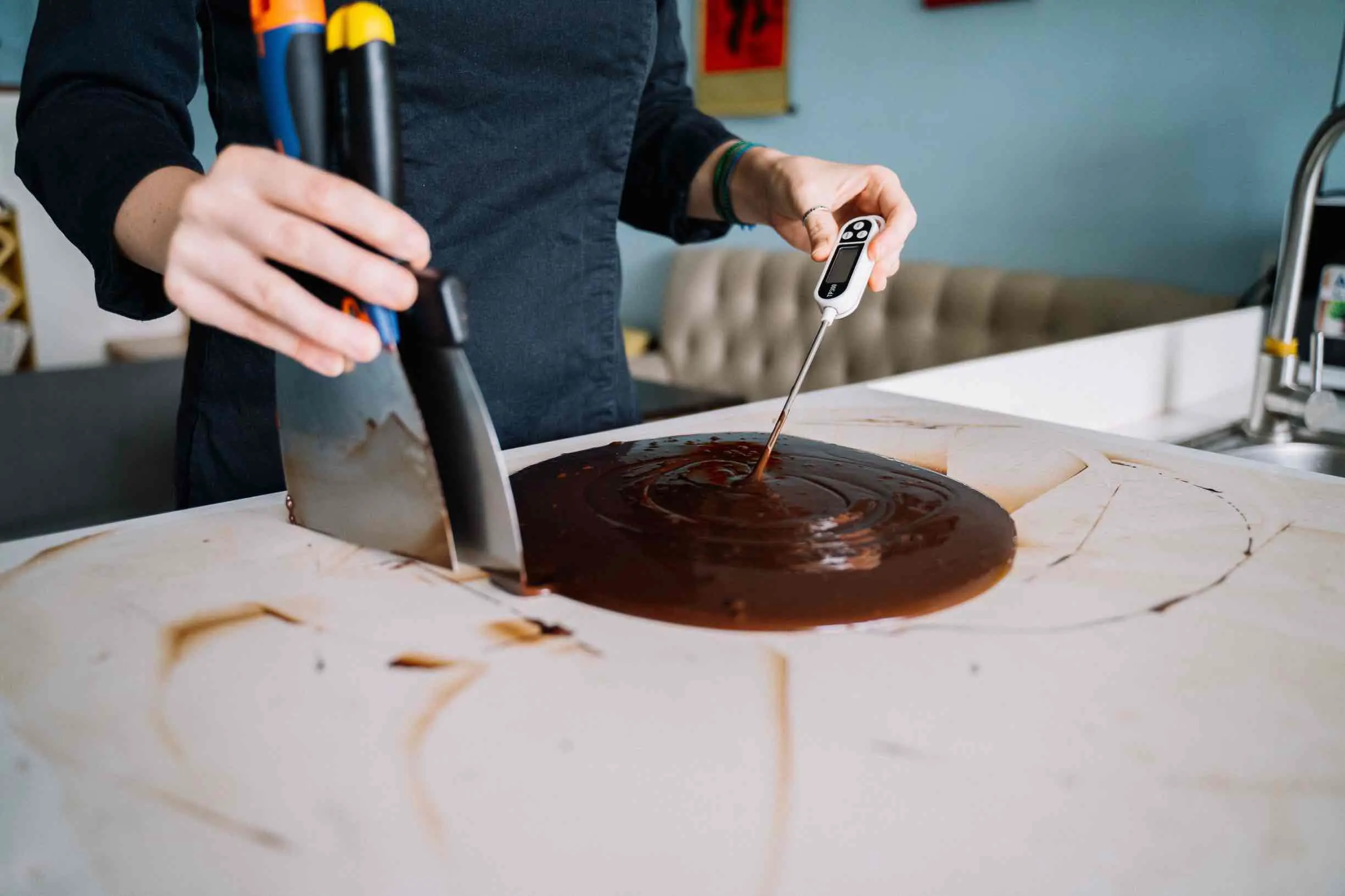 Removing melted chocolate from a surface during Halloween cleanup