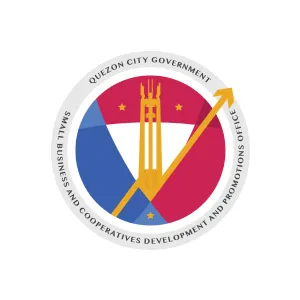 Seal of Quezon City Government Small Business and Cooperatives Development and Promotions Office featuring a stylized tower and arrow over a red and blue shield with three stars.