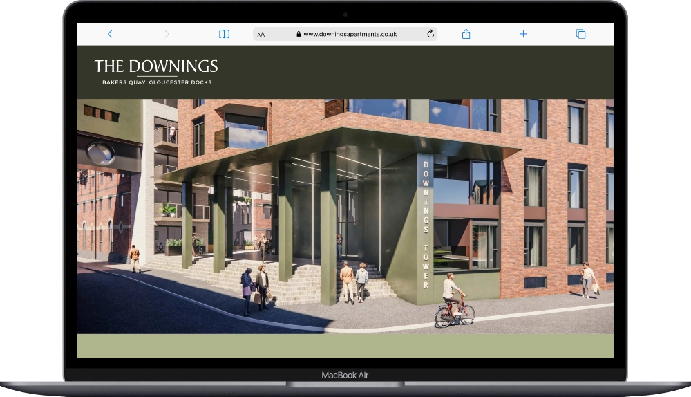 The Downings Apartments website shown on a laptop screen