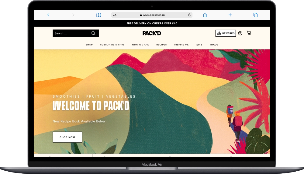 PACK'D website shown on a laptop screen