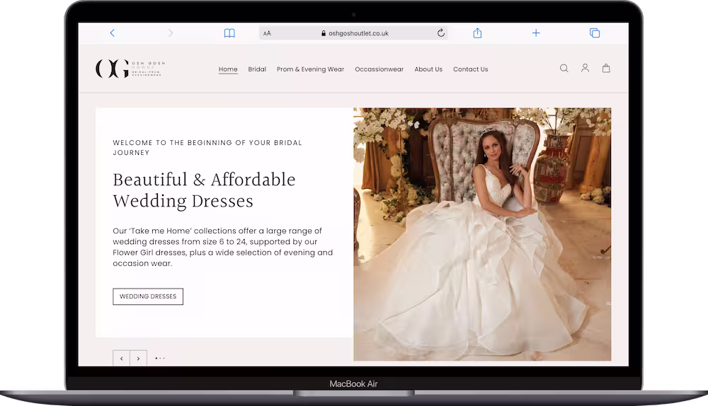 Osh Gosh Outlet website shown on a laptop screen