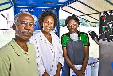 Dr Ernst Hebert of Alabama A&M with students in front of BioPro 190