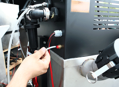 Step 5 to install pressurized water kit: reconnect screws and close back lid