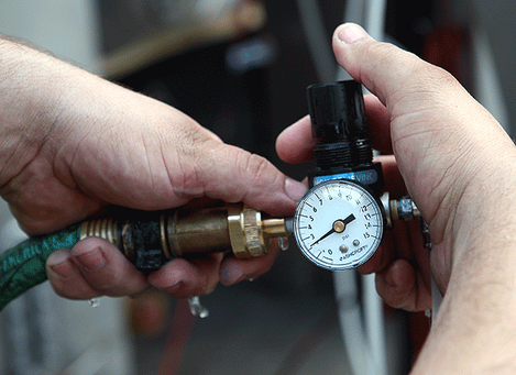 Step 9 to install pressurized water kit: adjust water pressure knob