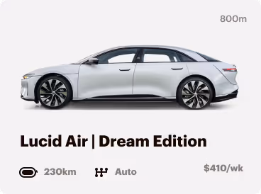 Side view of a silver Lucid Air Dream Edition electric car against a light gray background.