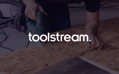 Person using a jigsaw to cut a wooden board.