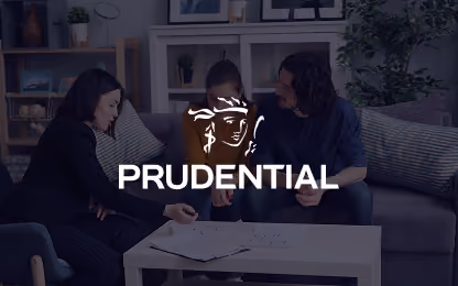 Three people sitting on a sofa in a living room with Prudential logo overlayed.
