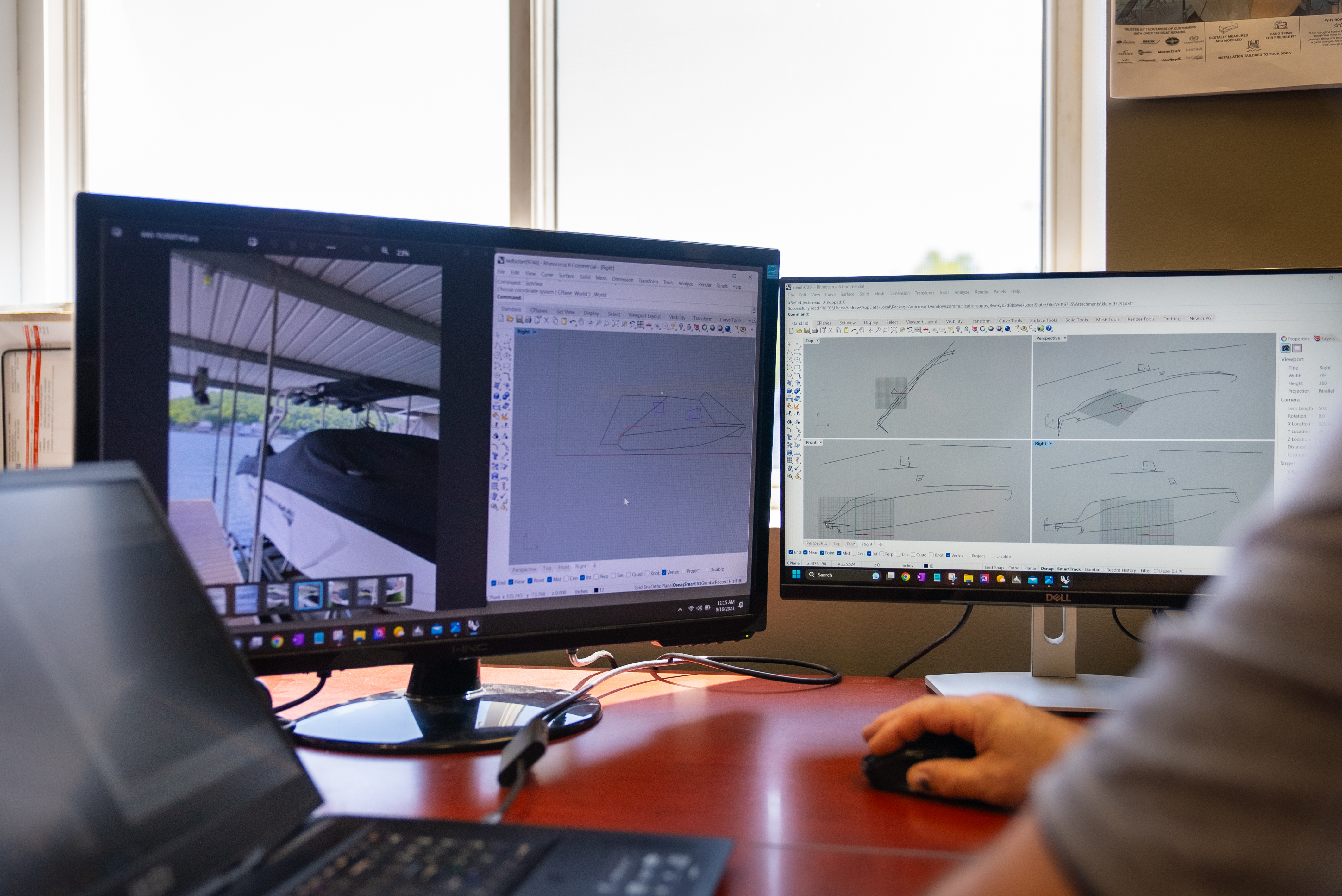 A Marine Concepts technician digitally measures a boat at the dock