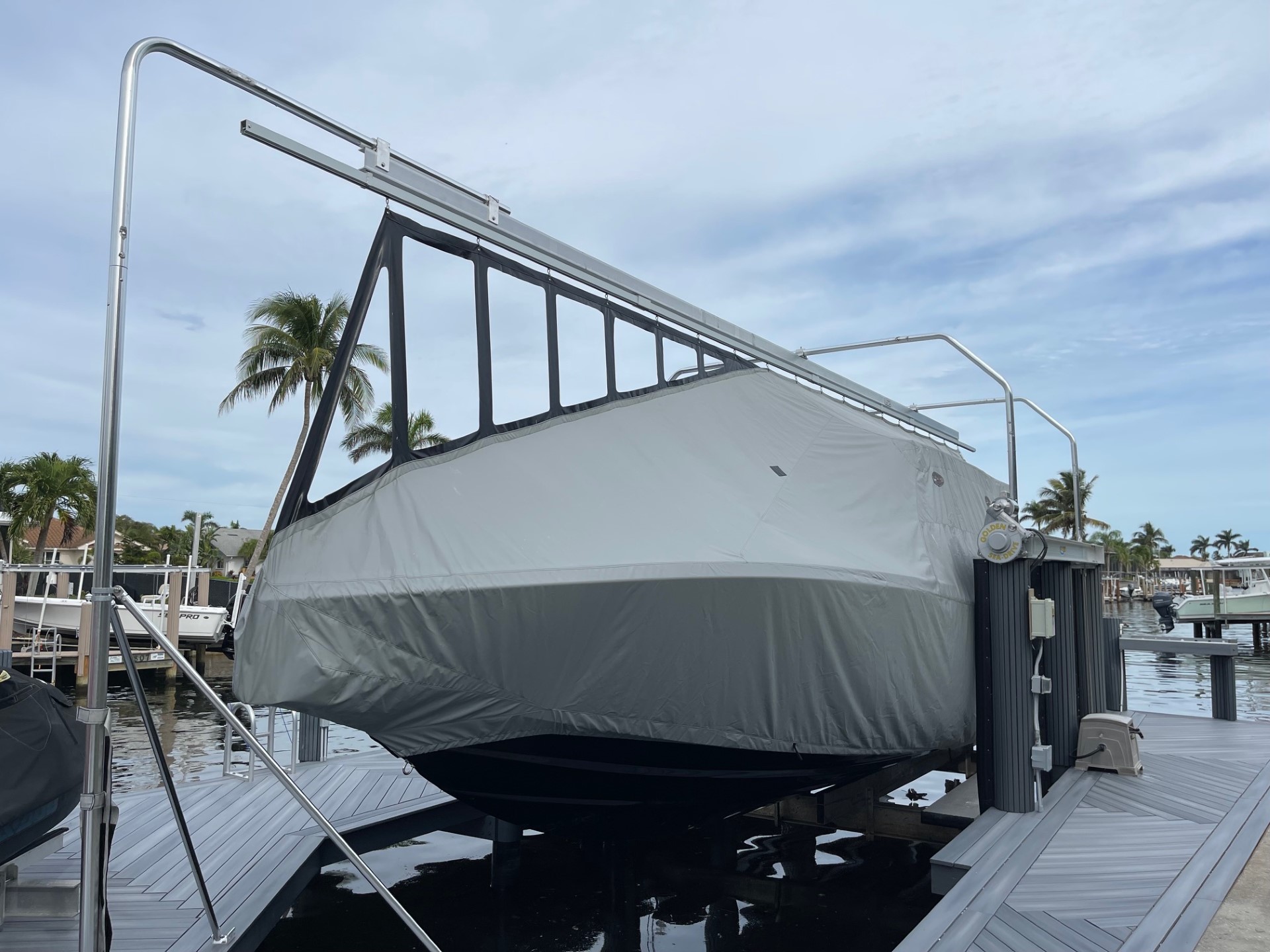 Bridge frame and track over an open boat lift