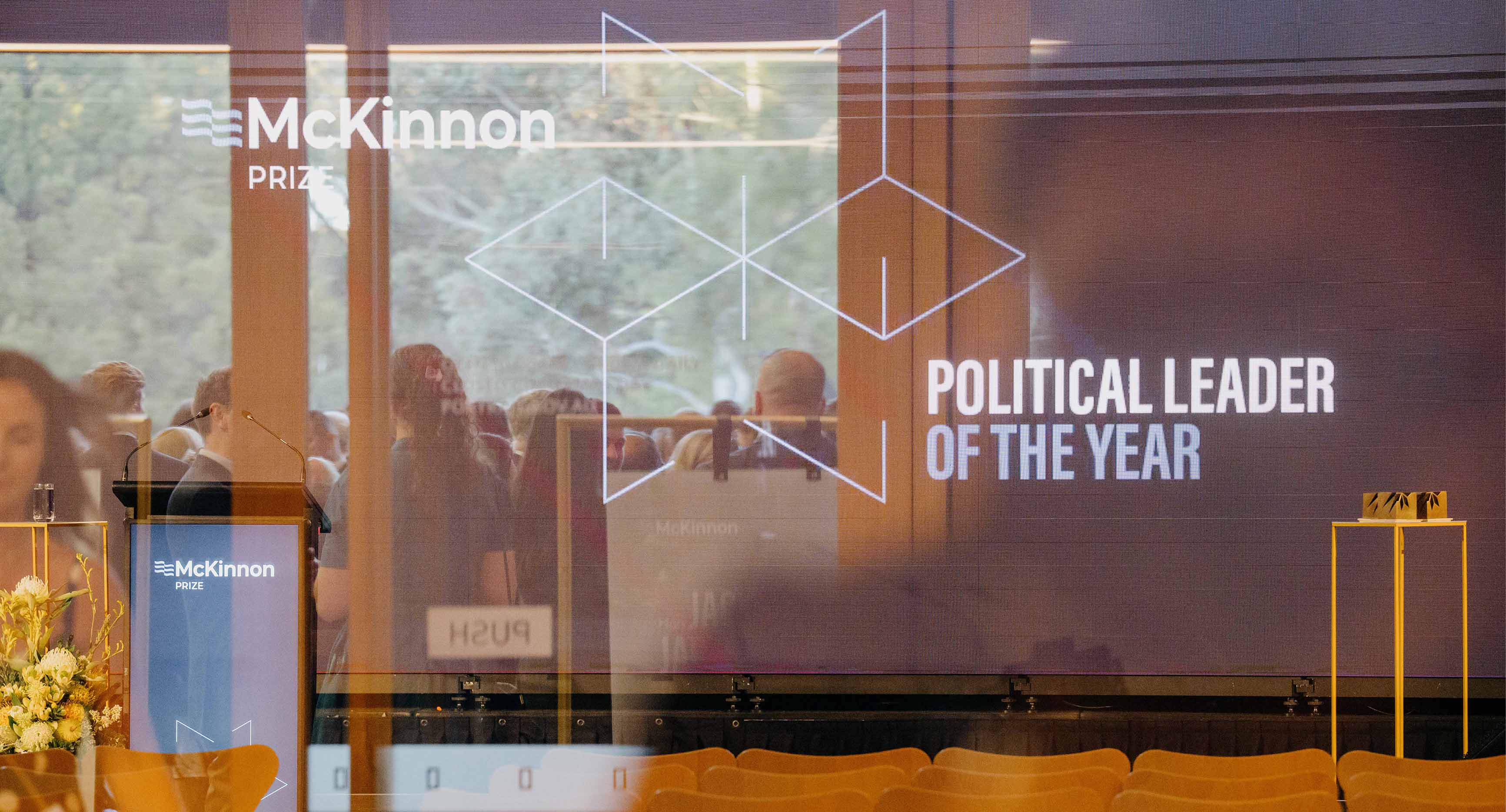 Photo from the McKinnon Prize event 2025. An artistic shot of the inside and reflective outside of the event.