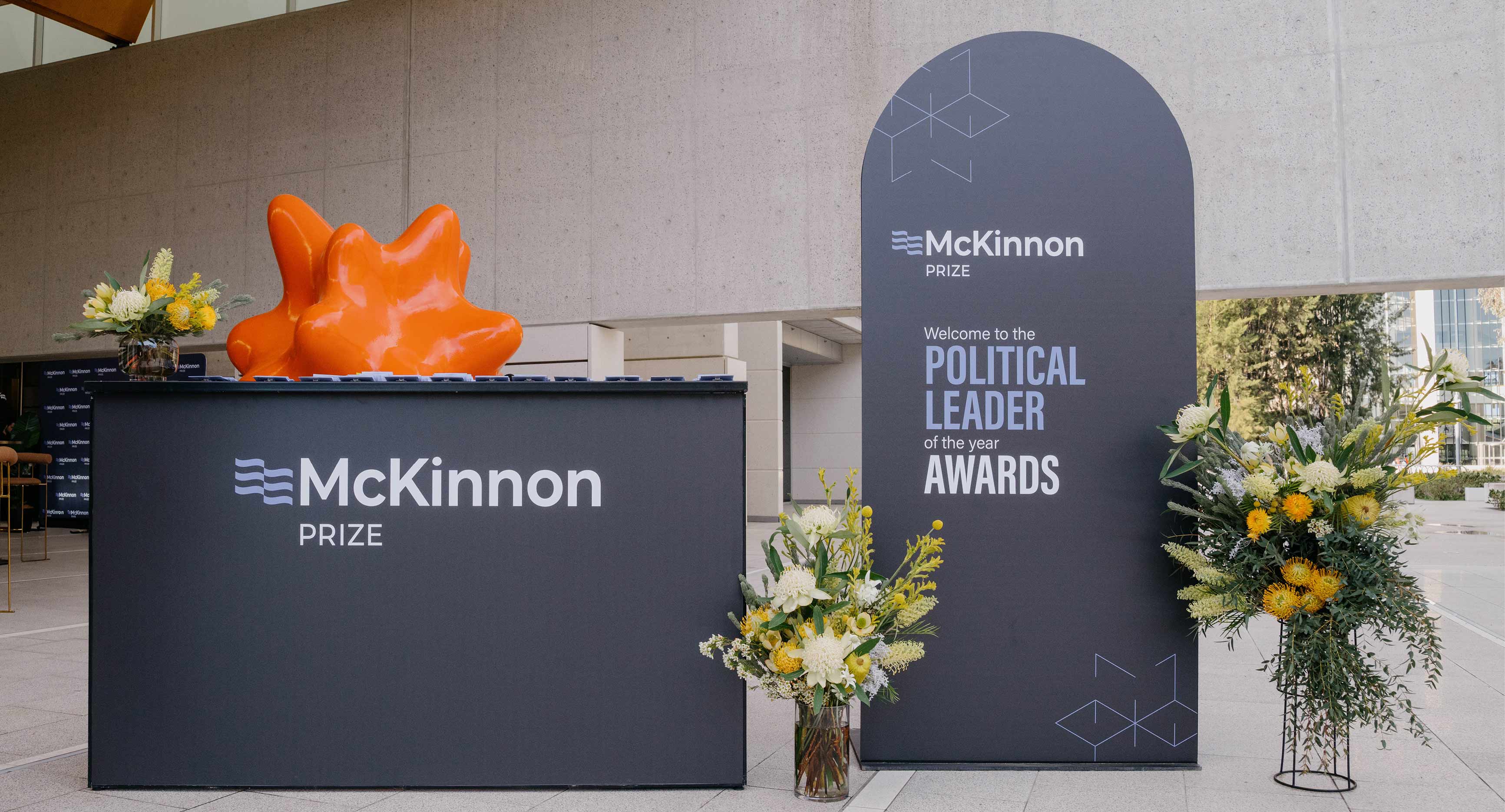 Photo from the McKinnon Prize event 2025. Welcome desk and banner outside the National Portrait Gallery event space.