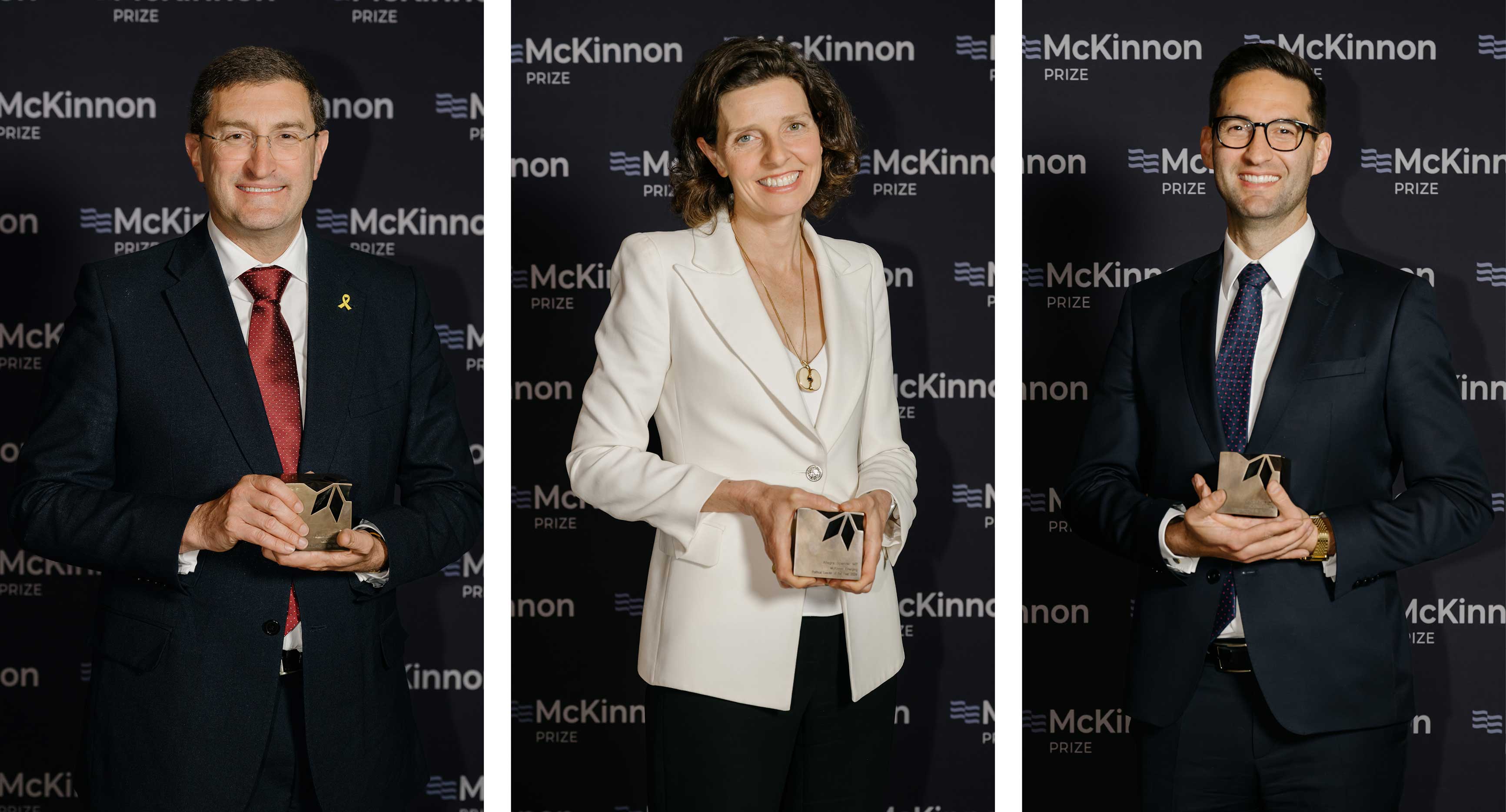 Photo from the McKinnon Prize event 2025. Three winners of the McKinnon Prize with their trophies.