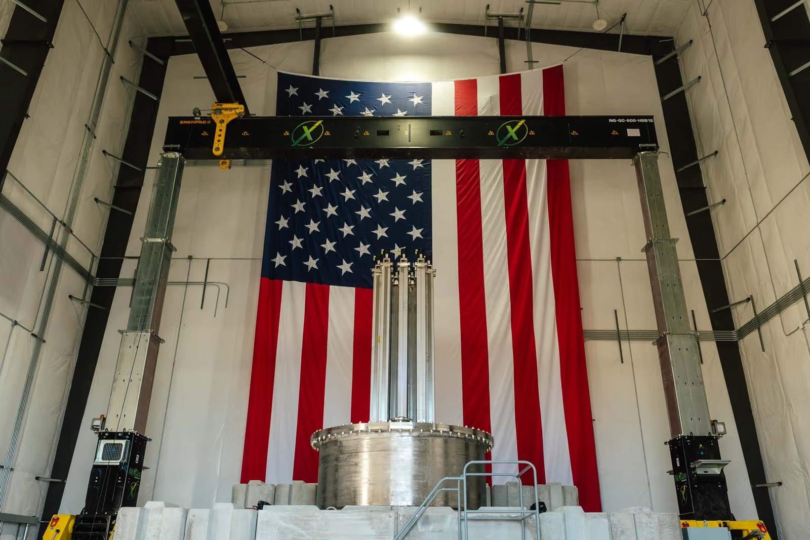 The Aalo-X reactor vessel in front of a U.S. flag at Idaho National Laboratory