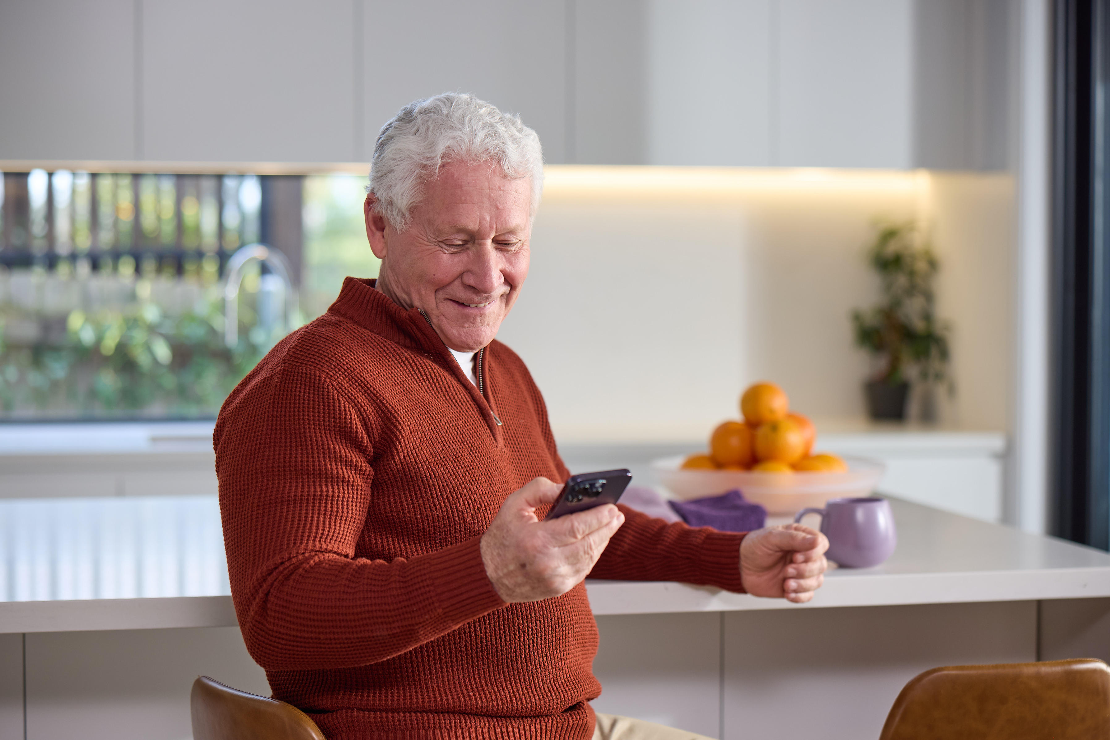 Patient checking their phone at home