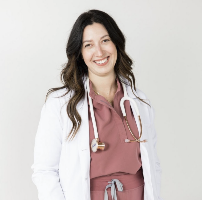 Dr. Tara Harding in a white coat with a stethoscope