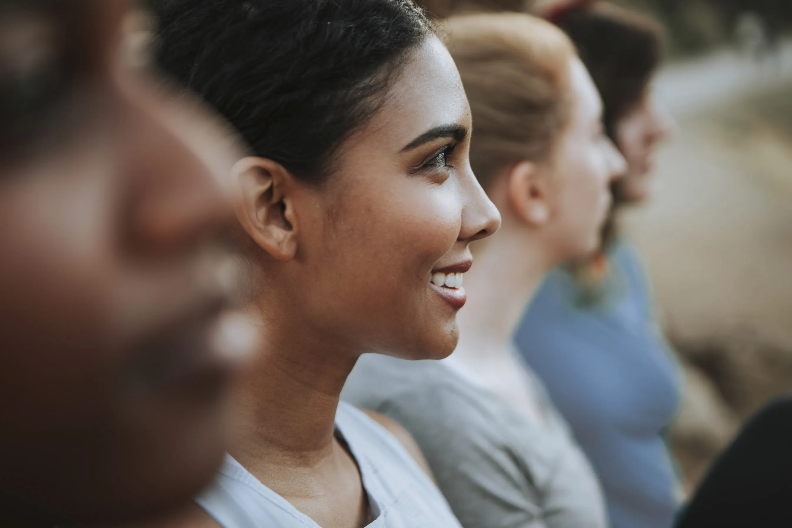 Multiple different women standing side-by-side