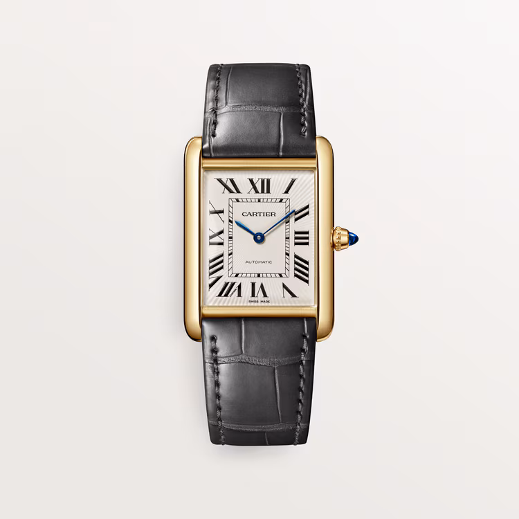 Rectangular gold Cartier watch with black leather strap and Roman numeral dial.