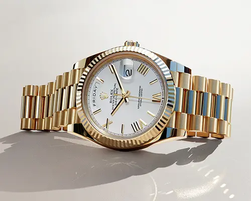 Gold Rolex Day-Date watch with white dial, Roman numerals, and day-date display, on gold bracelet.