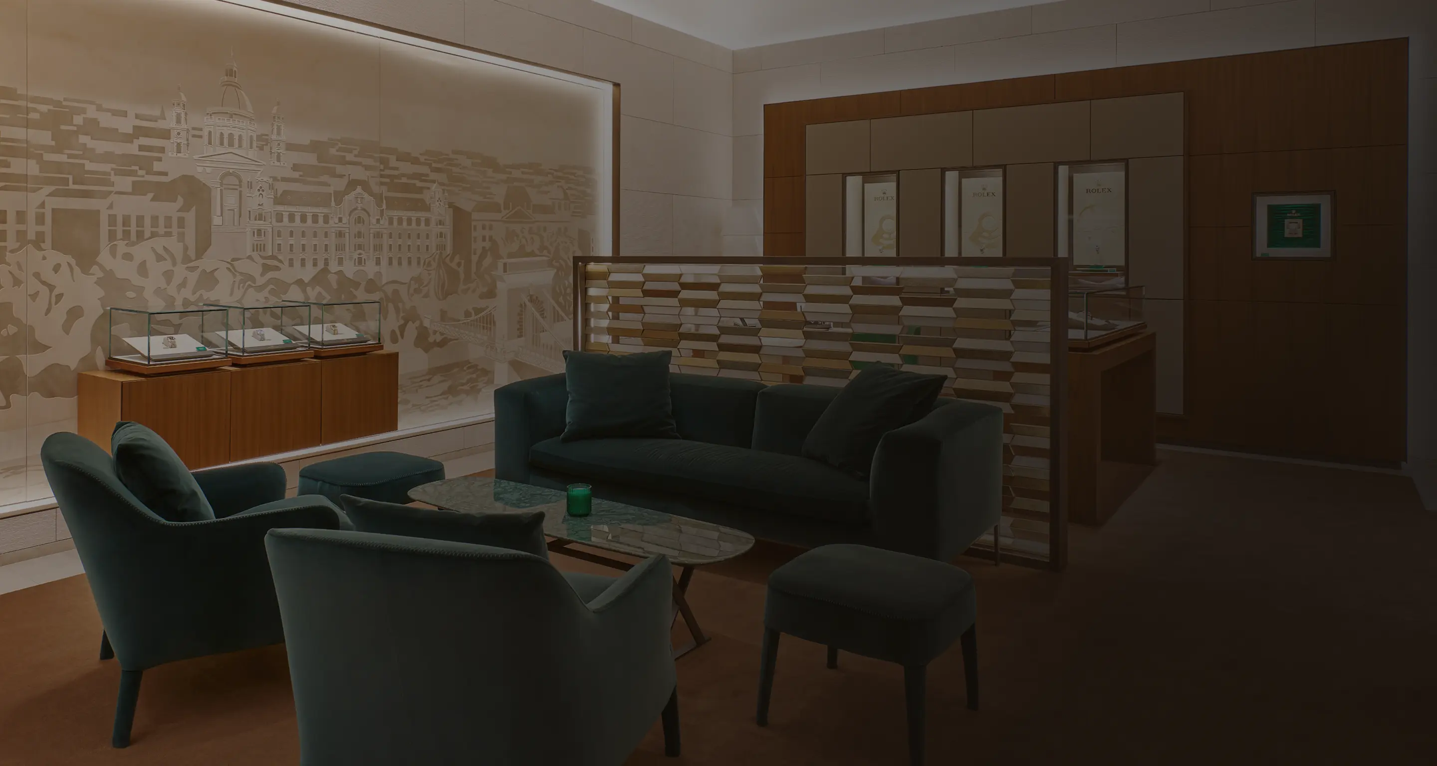Luxury showroom lounge with dark blue sofa, armchairs, glass table, and display cases with watches.