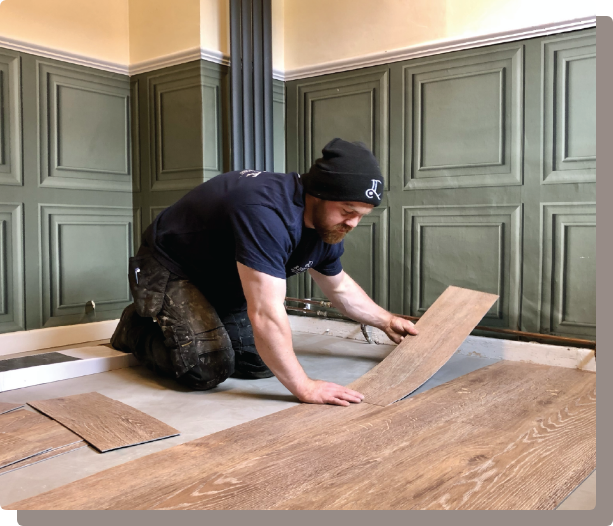 Regent Carpets & Flooring team fitting a floor