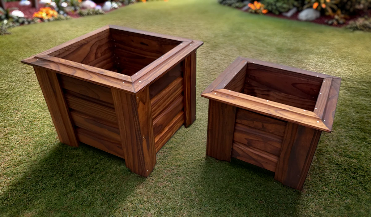 Two Cedar wood planters sat on a garden lawn
