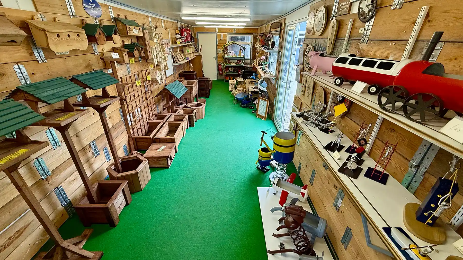 Part of the Turning Corners Factory Workshop in Hull, showing a myriad of recycled metal and wooden attendee made items for sale.