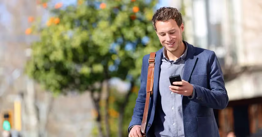 a business man looking at his phone