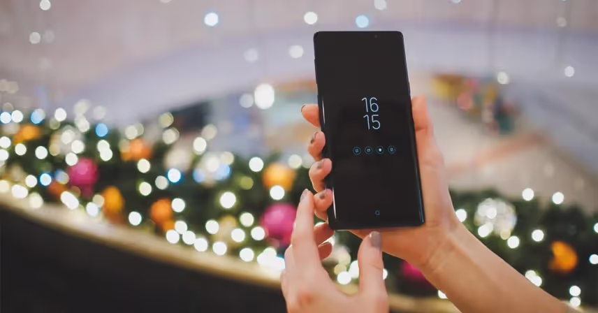 a hand holding a galaxy phone