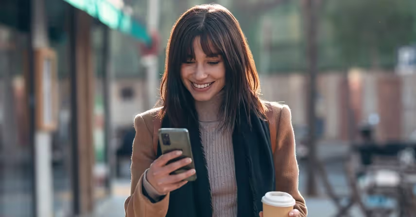 a woman holding a mobile phone