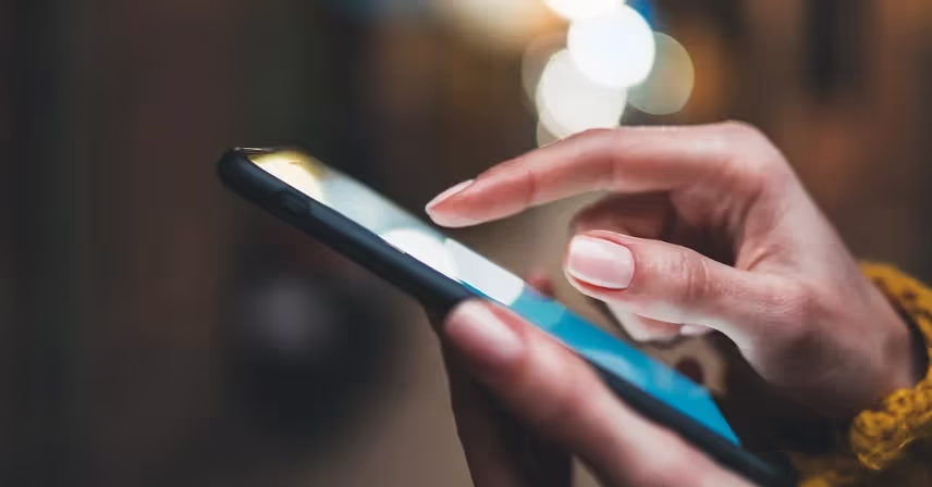 a person holding a mobile phone