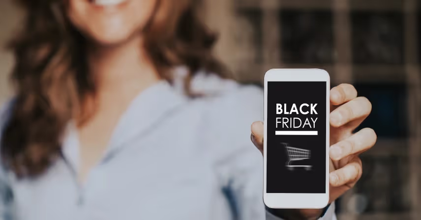 a person holding a phone that says black friday