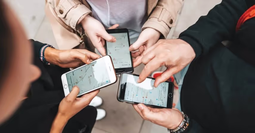 a group of people holding cell phones