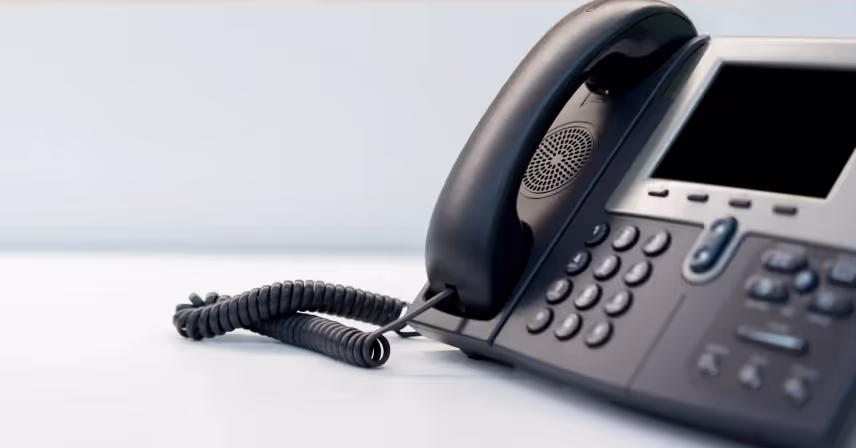 a black landline with a cord