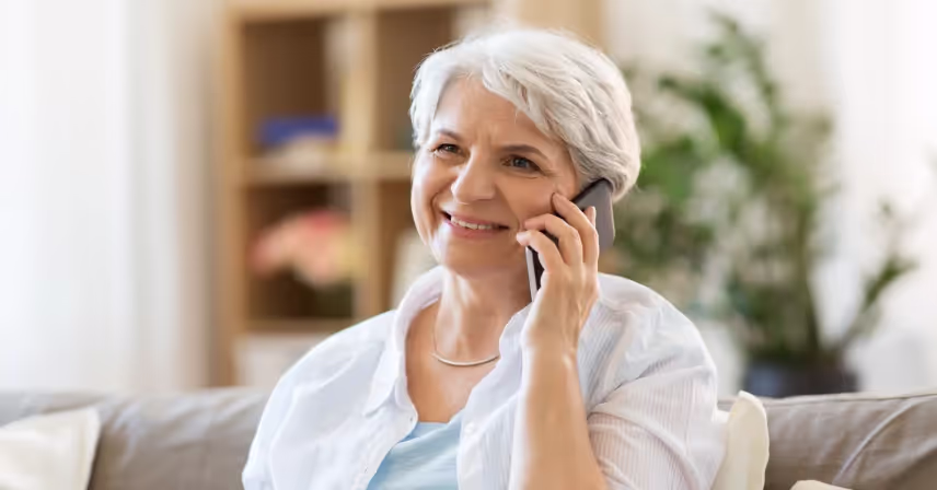 a senior using a cell phone for a phone call