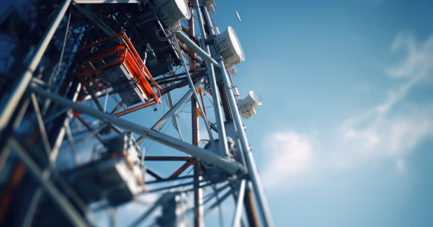 cell phone tower against a backdrop of a clear blue sky