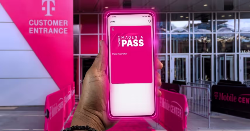 A hand is holding a smartphone near a "T-Mobile Customer Entrance" marked in pink. The phone screen displays a "T-Mobile Magenta Pass."
