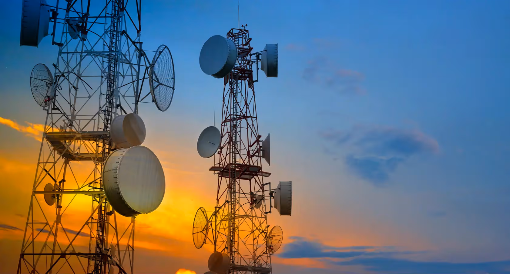 A telecommunications cell tower is shown against a clear blue sky. The text "COX Mobile" is displayed to the left of the tower.