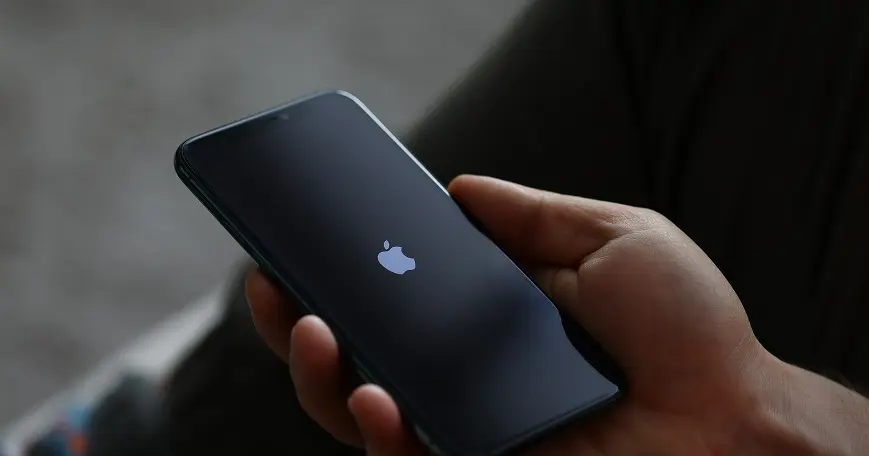 a pile of apple iphones on a table